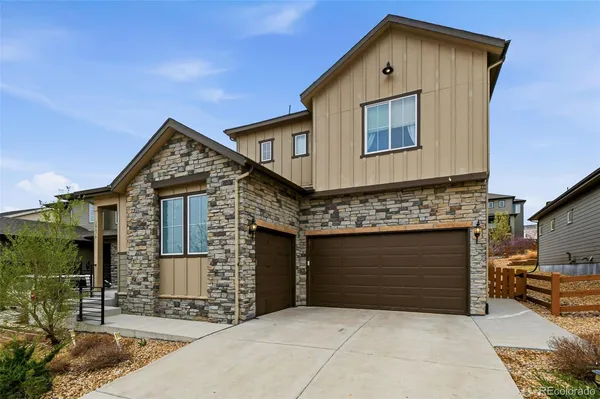 a front view of a house with garage