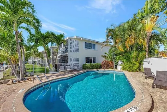 a view of a swimming pool with a patio