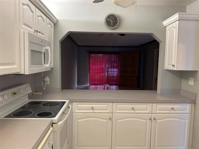 a kitchen with a refrigerator and a sink