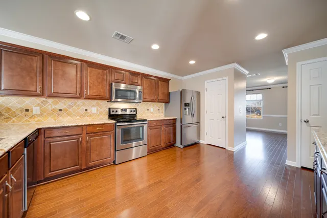 a view of cabinets with wooden floor