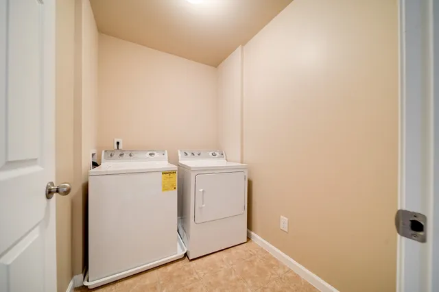 an empty room with a empty space and windows