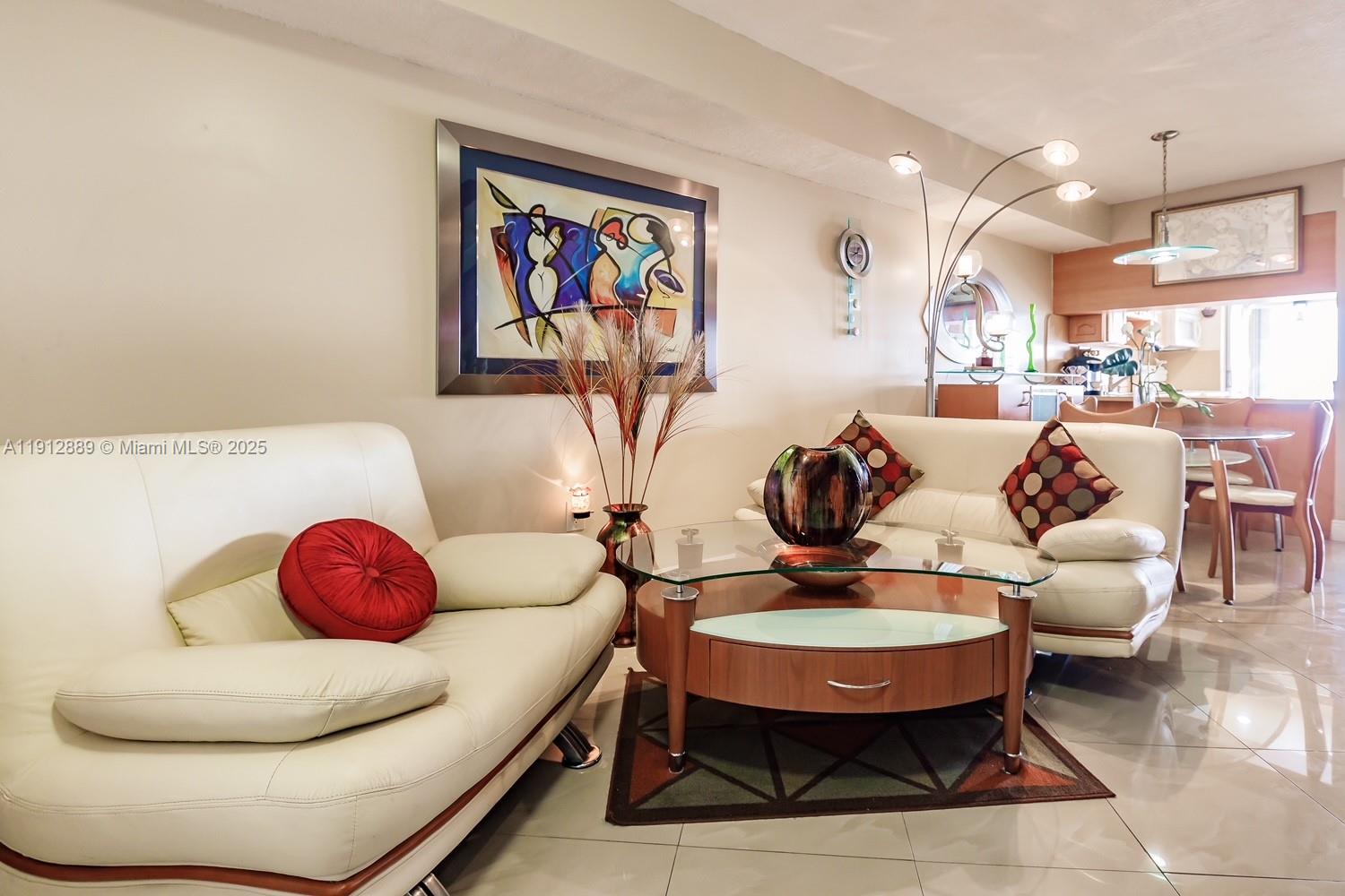 2670 West 60th Street, Unit 90 Hialeah, FL 33016 - Photo 4 of 26 a living room with furniture and a rug