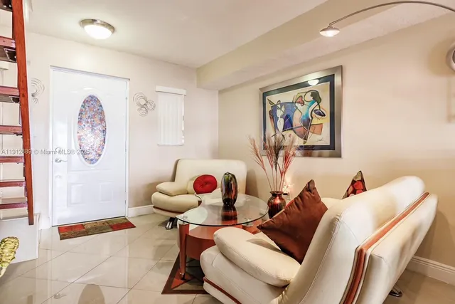 a living room with furniture and a table