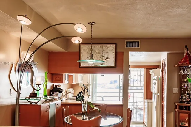 a room with musical instrument pool table and windows