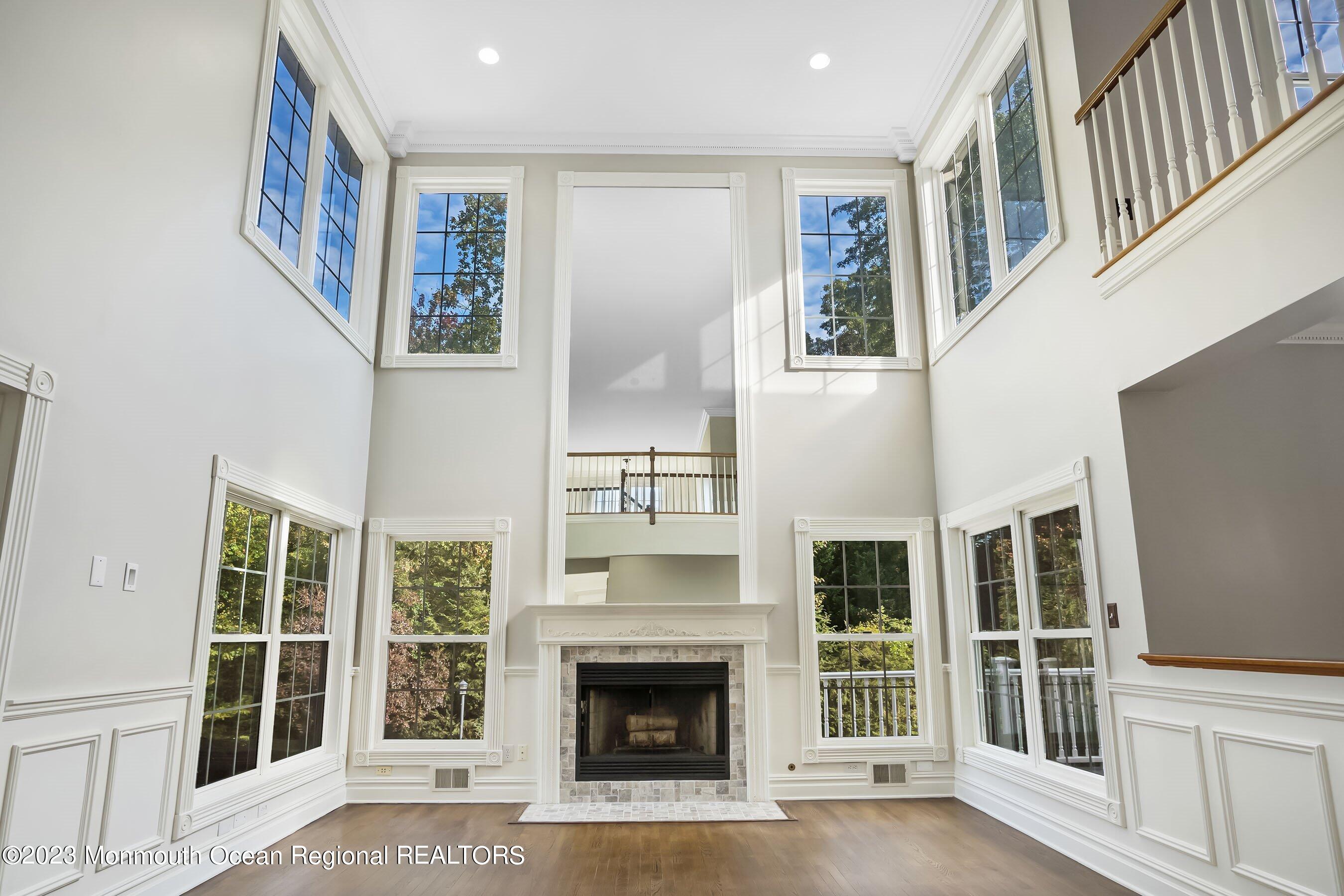 3 Copperleaf Lane Colts Neck, NJ 07722 - Photo 11 of 47 a view of an entryway with furniture and fireplace