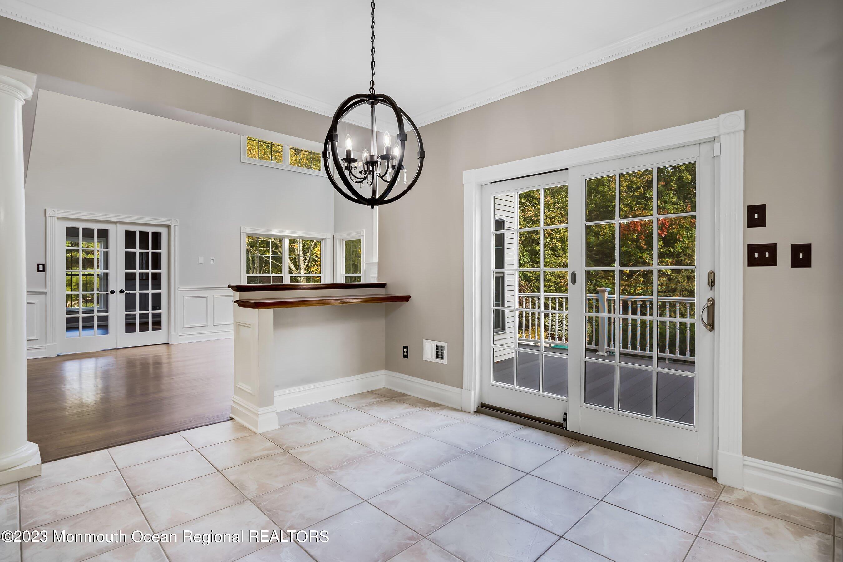3 Copperleaf Lane Colts Neck, NJ 07722 - Photo 21 of 47 a view of a big room with wooden floor and windows
