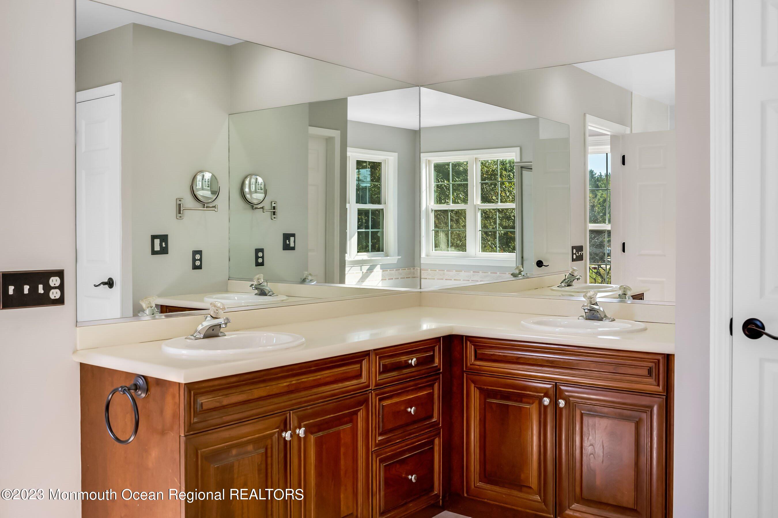 3 Copperleaf Lane Colts Neck, NJ 07722 - Photo 29 of 47 a bathroom with a sink and a mirror