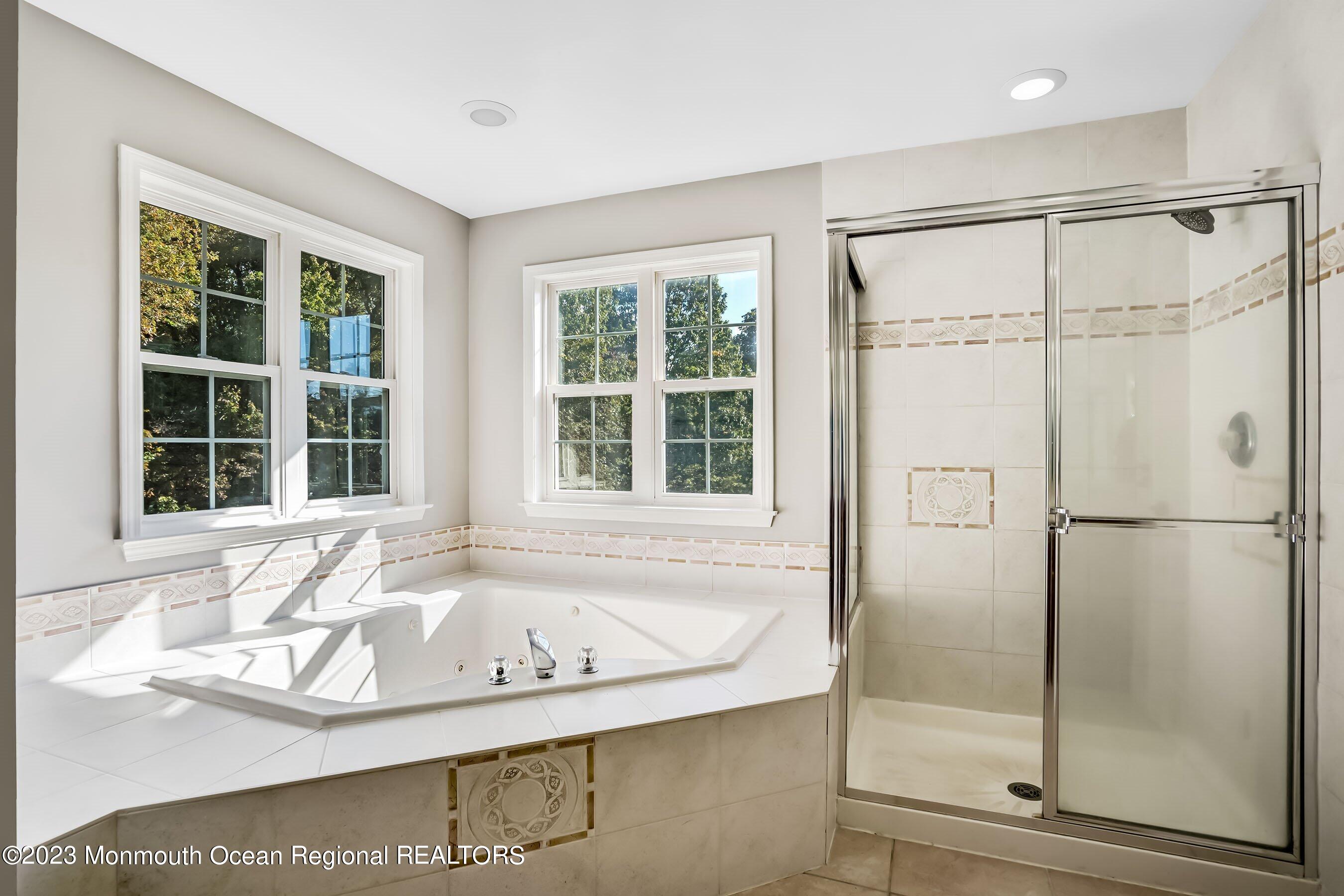 3 Copperleaf Lane Colts Neck, NJ 07722 - Photo 30 of 47 a bathroom with a bathtub and a shower