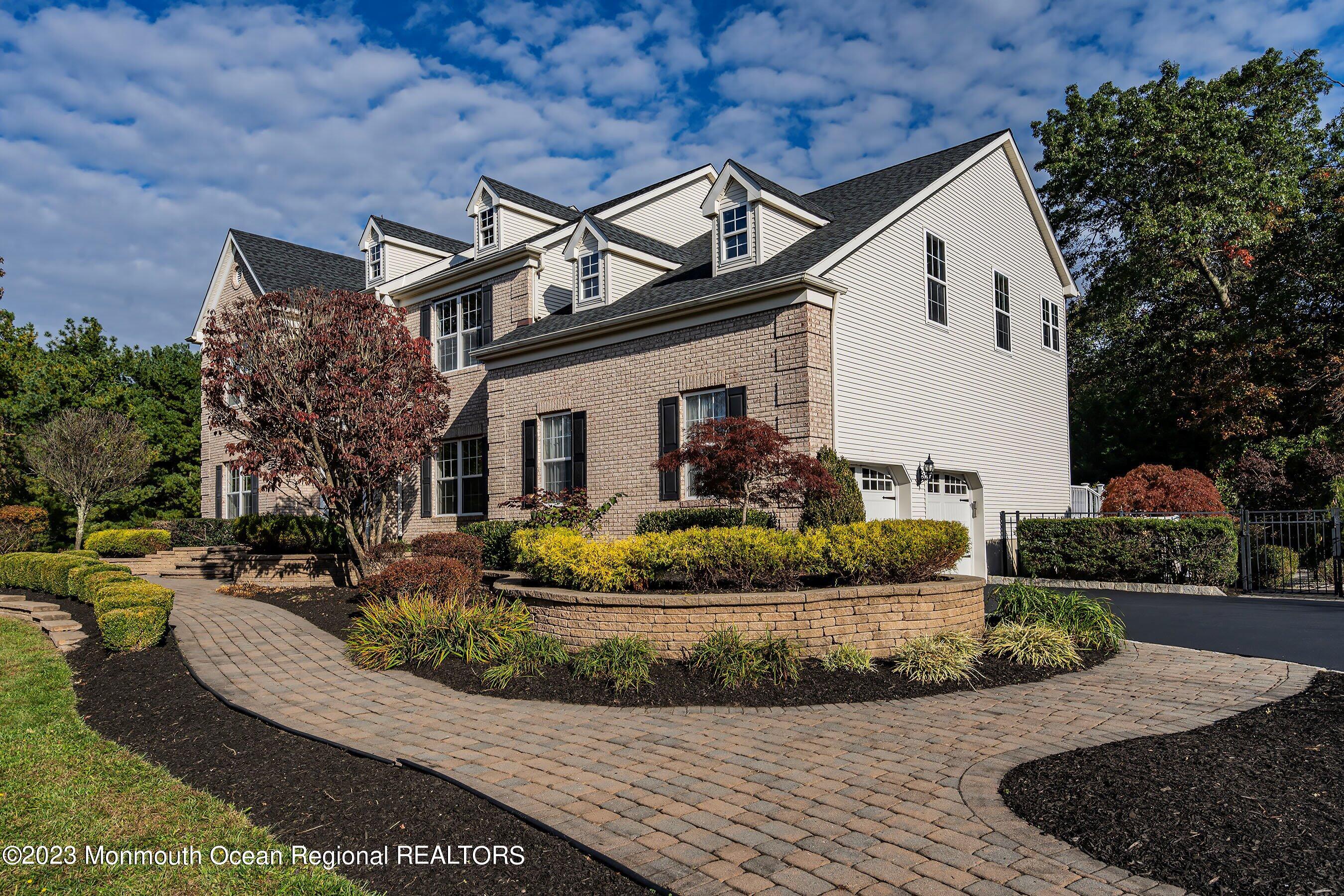 3 Copperleaf Lane Colts Neck, NJ 07722 - Photo 3 of 47 a view of a white house with a small yard and plants
