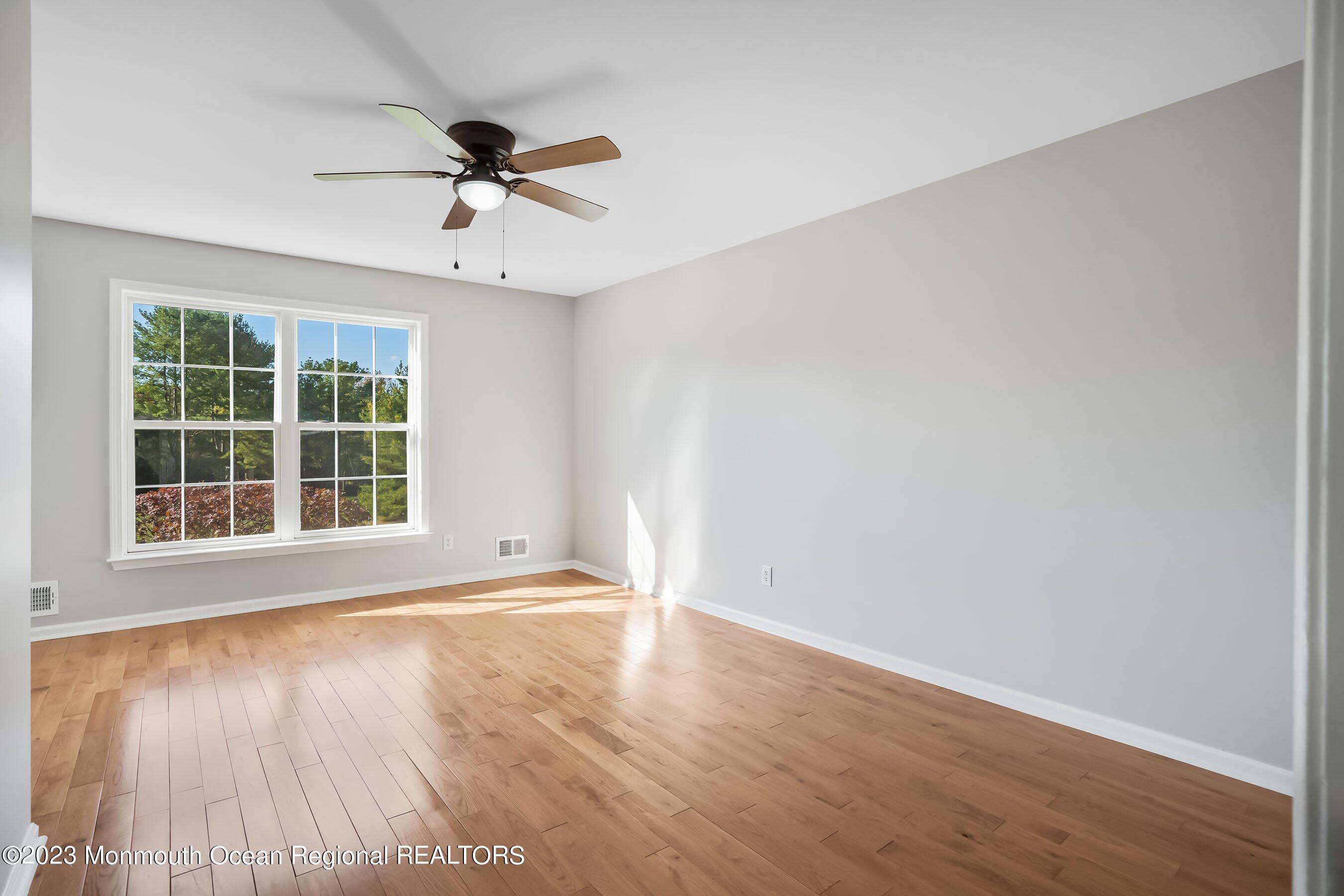3 Copperleaf Lane Colts Neck, NJ 07722 - Photo 31 of 47 wooden floor in an empty room with a window