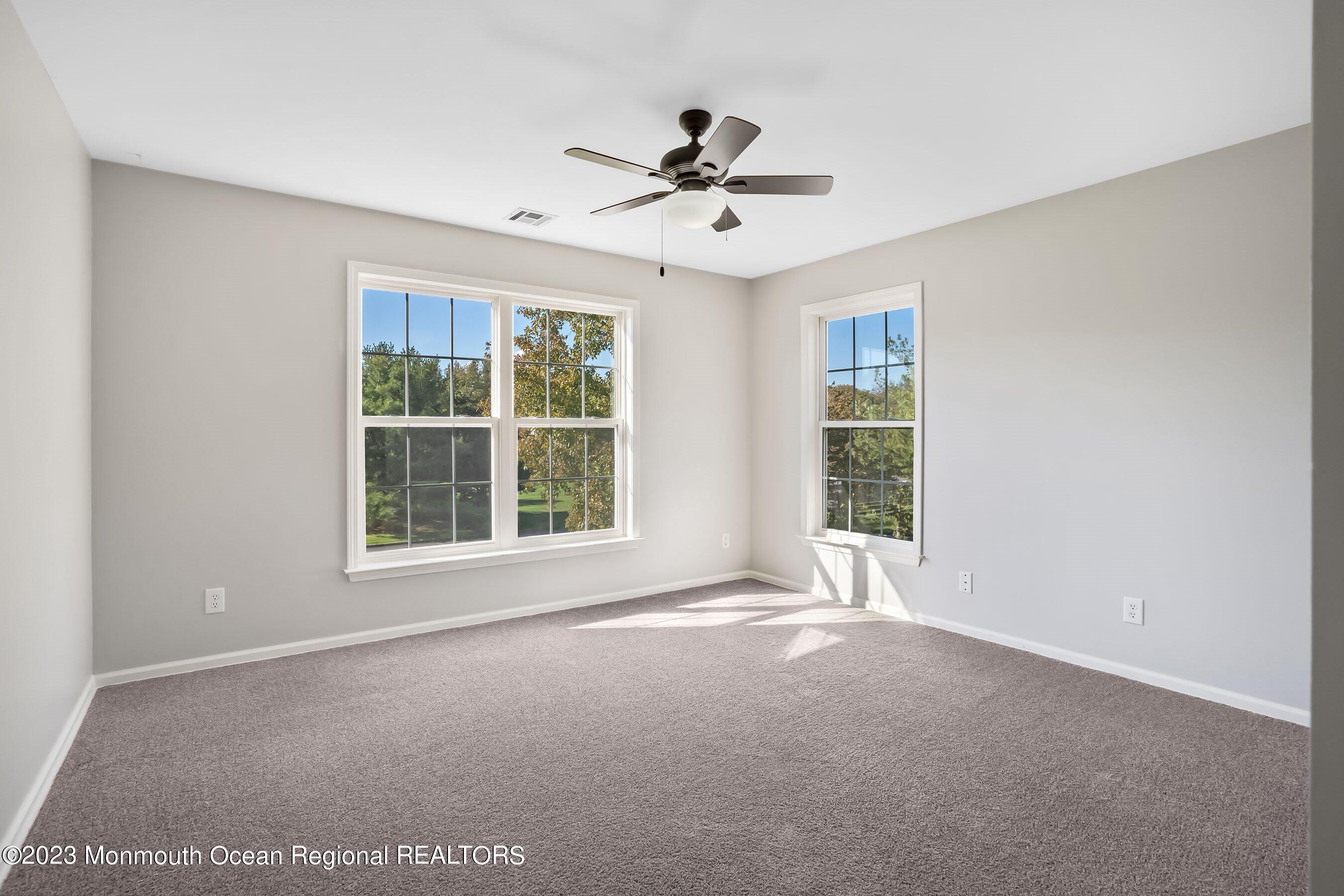 3 Copperleaf Lane Colts Neck, NJ 07722 - Photo 35 of 47 a view of a livingroom with a ceiling fan and window