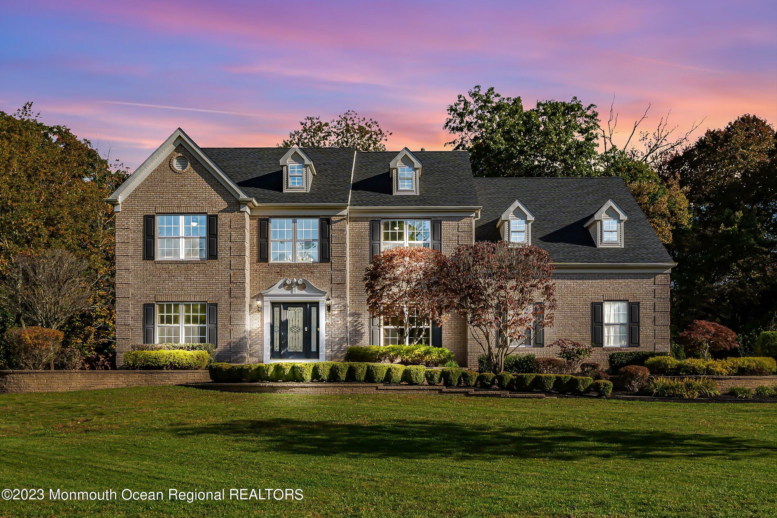 3 Copperleaf Lane Colts Neck, NJ 07722 - Photo 4 of 47 a front view of a house with a garden