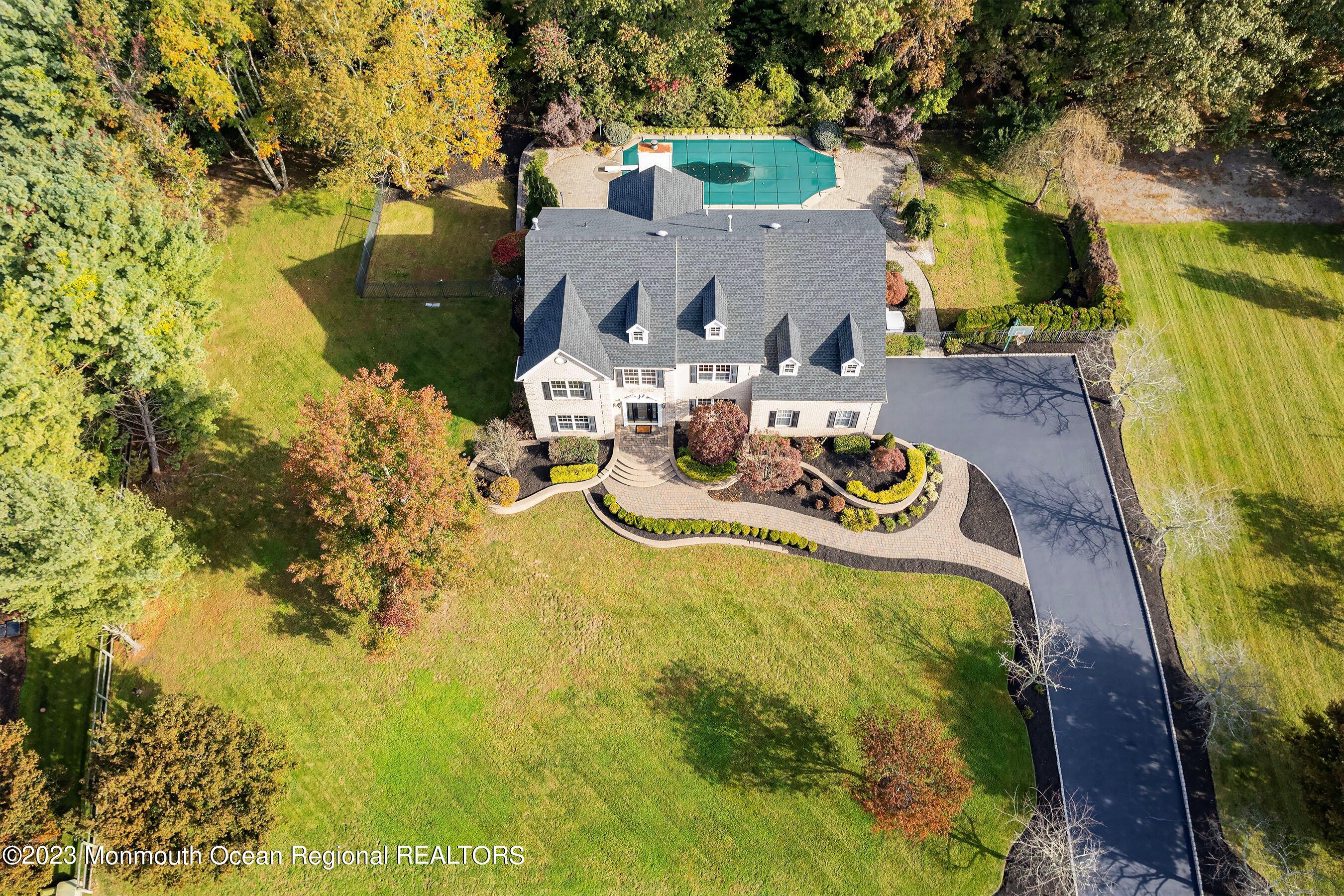 3 Copperleaf Lane Colts Neck, NJ 07722 - Photo 44 of 47 a view of table and chairs in the patio