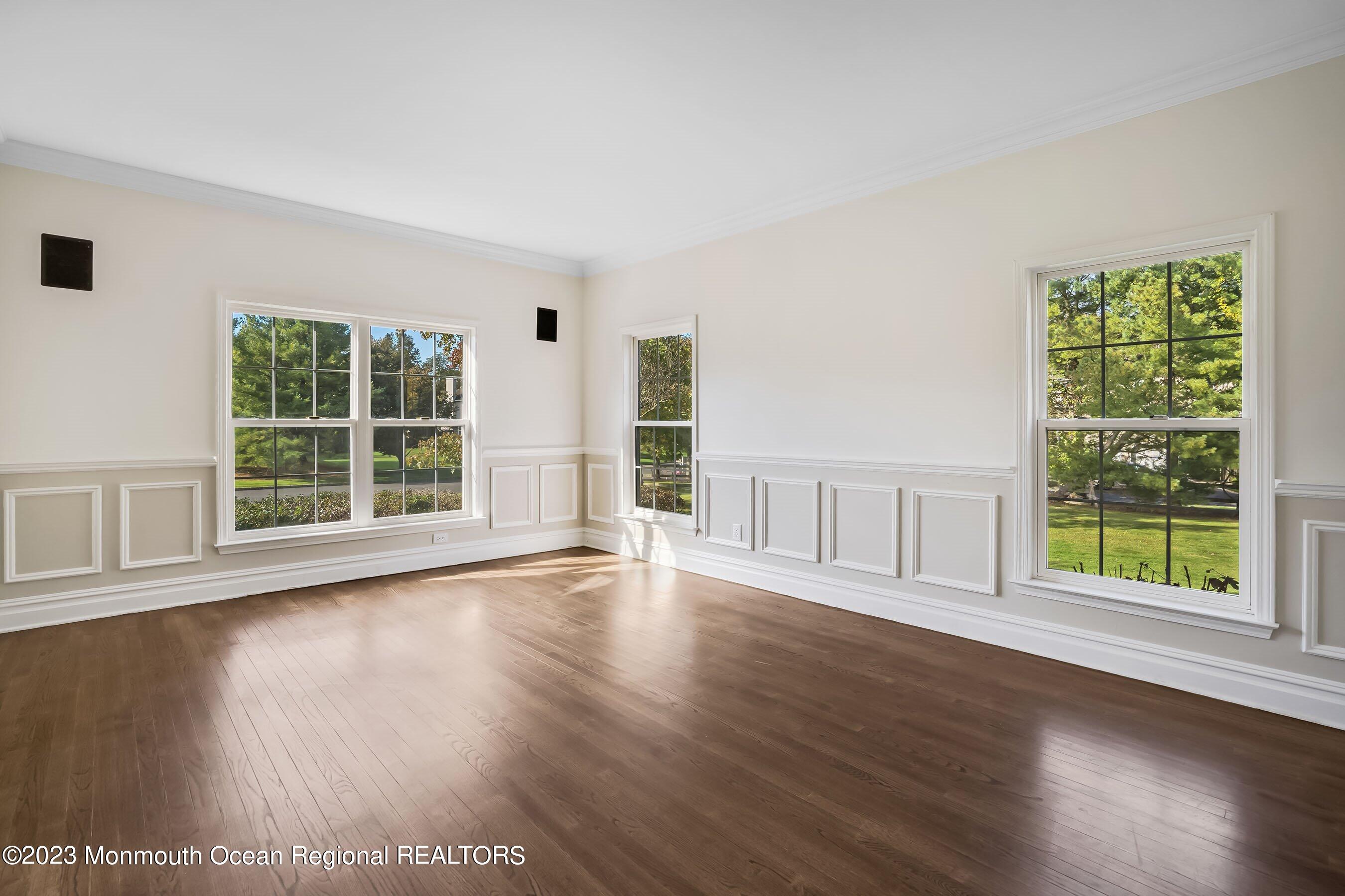 3 Copperleaf Lane Colts Neck, NJ 07722 - Photo 10 of 47 a view of an empty room with wooden floor and a window
