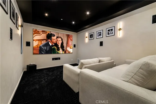 a living room with furniture and wall painting