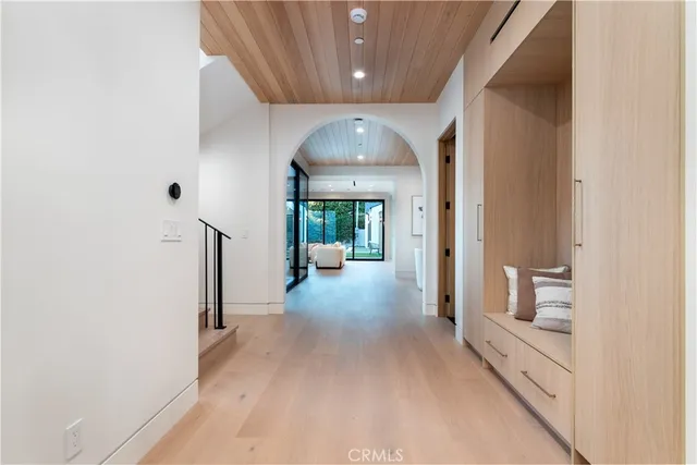 a view of hallway with wooden floor