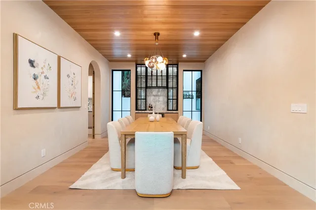 a view of a very nice looking dining room with a large window