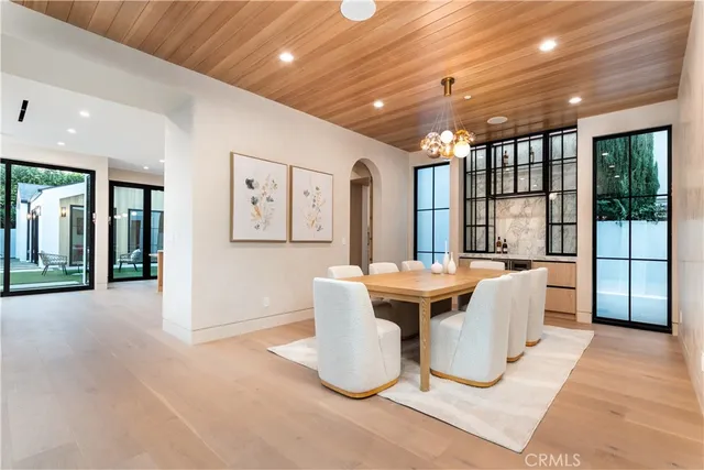 a living room with large couches and chandelier