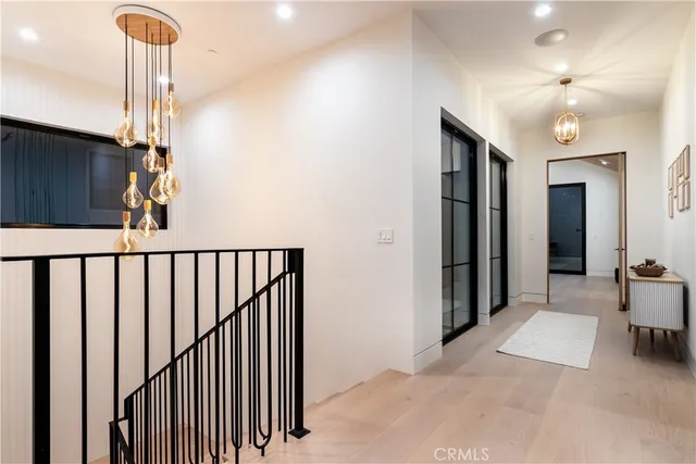 a view of a hallway with windows