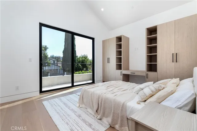 a bedroom with a bed and a view of bedroom