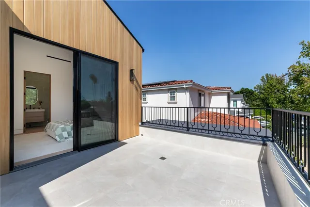 a bedroom with a bed and a desk