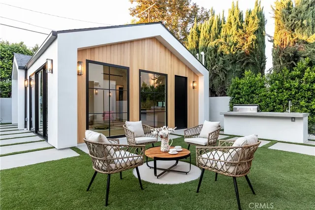 a aerial view of a house with a yard