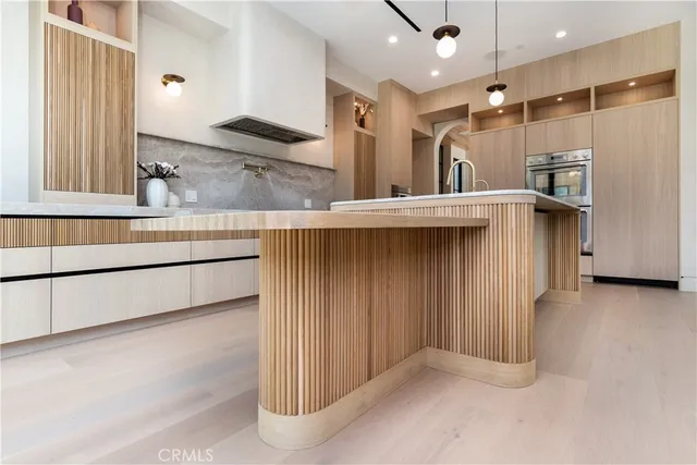 a kitchen with a refrigerator and a sink
