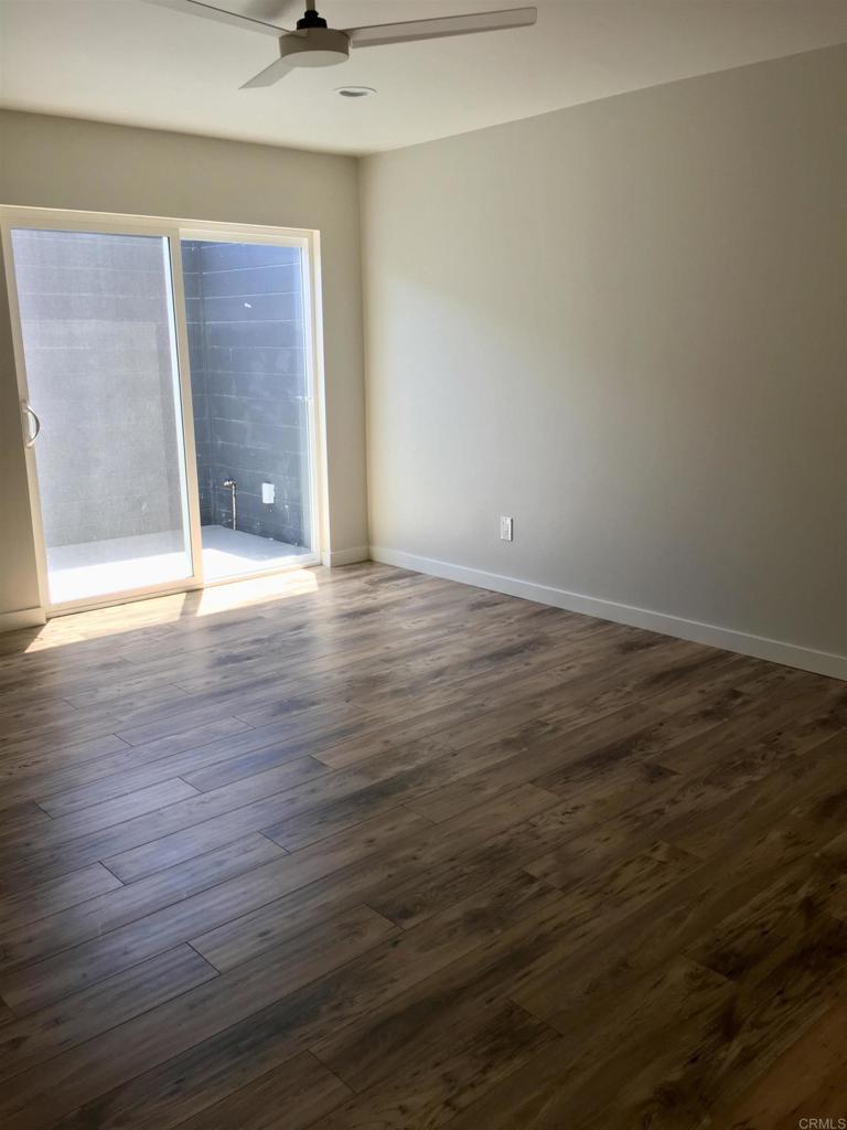 148 Europa Street Encinitas, CA 92024 - Photo 13 of 23 a view of an empty room with wooden floor and a window