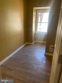 4623 Pulaski Avenue Philadelphia, PA 19144 - Photo 17 of 20 an empty room with wooden floor and windows