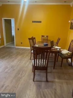 a view of a dining room with furniture and a table