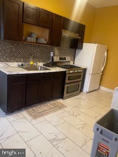 4623 Pulaski Avenue Philadelphia, PA 19144 - Photo 5 of 20 a kitchen with a sink and cabinets