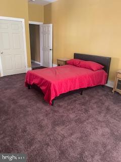 4623 Pulaski Avenue Philadelphia, PA 19144 - Photo 9 of 20 a bed sitting in a bedroom next to a window