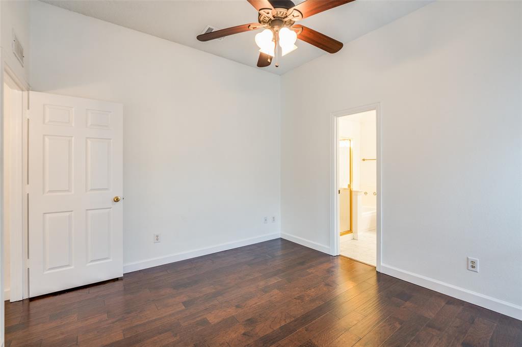 8160 Tower Road Frisco, TX 75035 - Photo 15 of 25 an empty room with wooden floor closet and windows