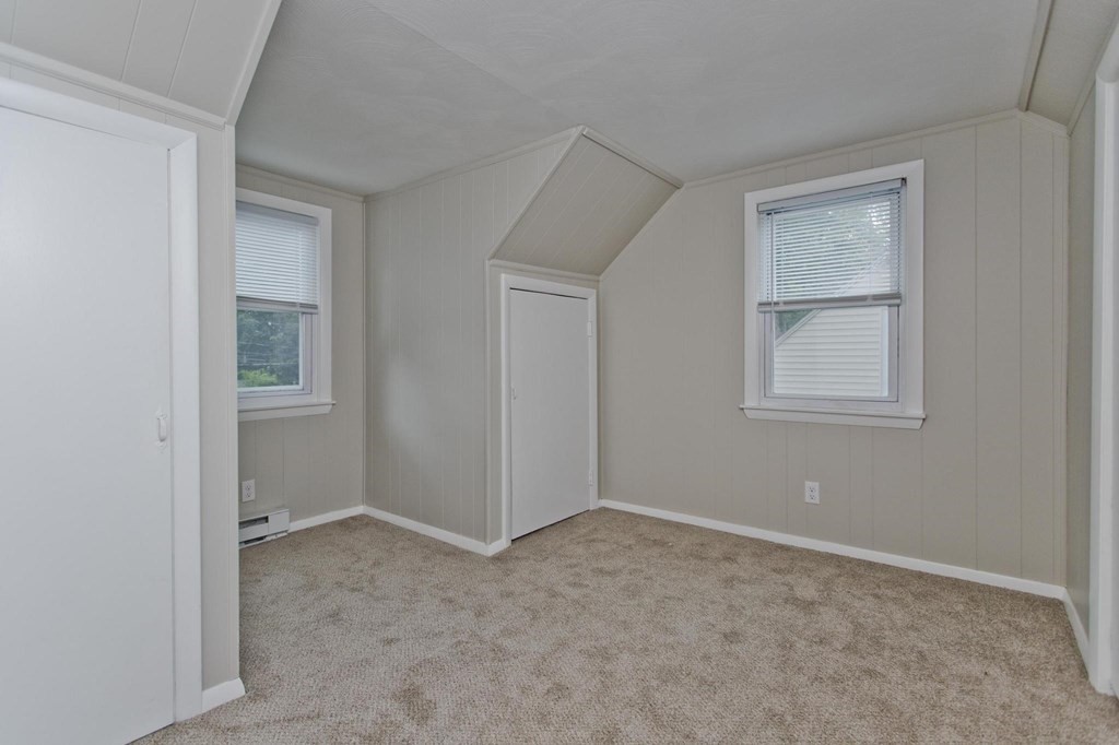 228 Shawmut Street Springfield, MA 01108 - Photo 25 of 39 a view of an empty room with closet and a window