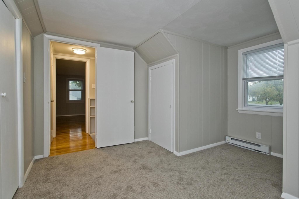 228 Shawmut Street Springfield, MA 01108 - Photo 28 of 39 a view of an empty room with window and bathroom