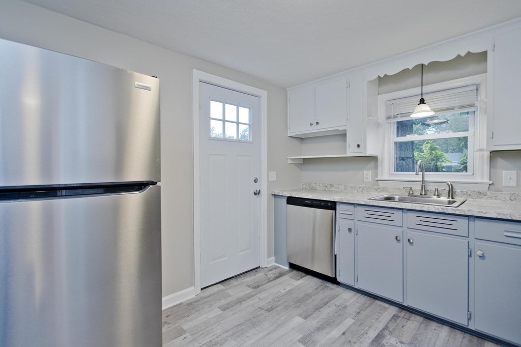 228 Shawmut Street Springfield, MA 01108 - Photo 7 of 39 a kitchen with a refrigerator and window