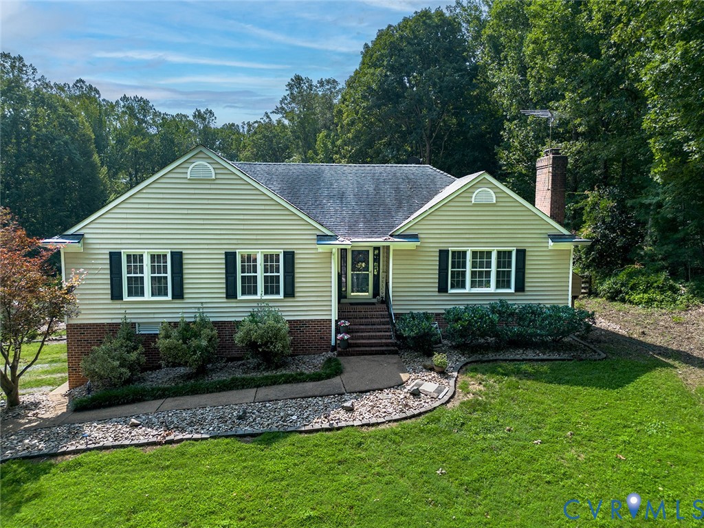 212 Copper Line Road Bumpass, VA 23024 - Photo 1 of 35 a view of a house with a yard plants and large tree
