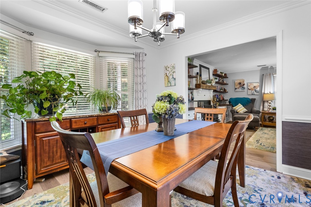 212 Copper Line Road Bumpass, VA 23024 - Photo 11 of 35 a view of a dining room with furniture window and wooden floor