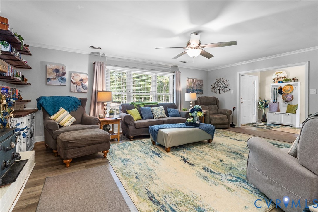212 Copper Line Road Bumpass, VA 23024 - Photo 12 of 35 a living room with furniture and a large window