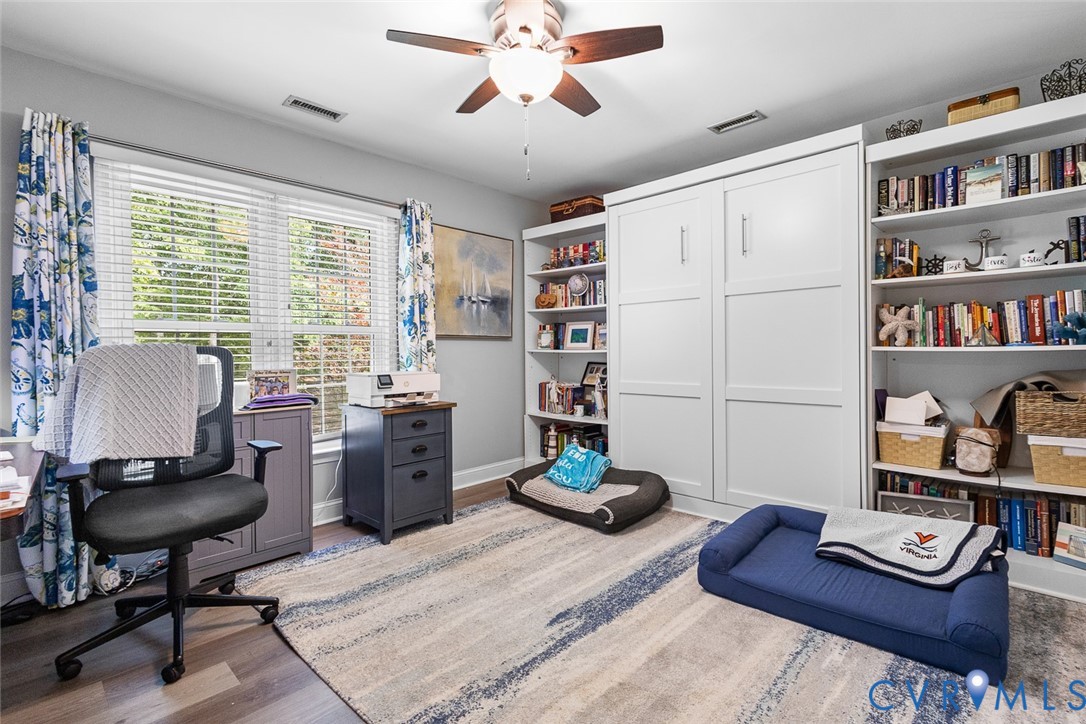 212 Copper Line Road Bumpass, VA 23024 - Photo 18 of 35 a living room with furniture and a book shelf