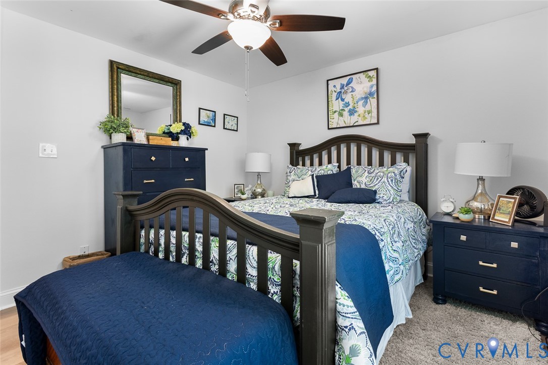 212 Copper Line Road Bumpass, VA 23024 - Photo 20 of 35 a bedroom with a bed and a dresser