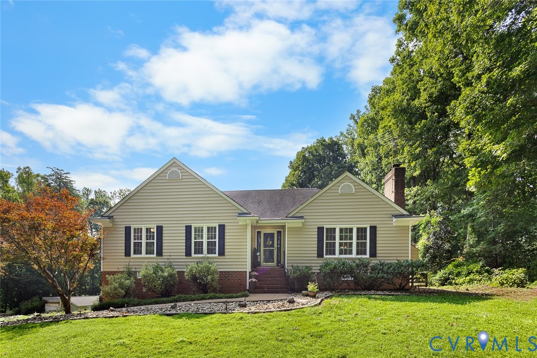 212 Copper Line Road Bumpass, VA 23024 - Photo 2 of 35 a front view of a house with garden