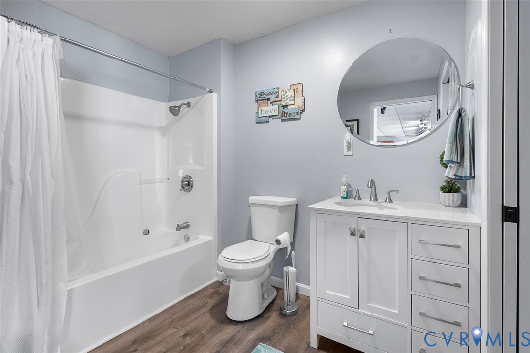 212 Copper Line Road Bumpass, VA 23024 - Photo 25 of 35 a bathroom with a sink a toilet and shower