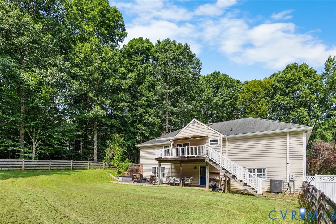 212 Copper Line Road Bumpass, VA 23024 - Photo 30 of 35 a view of a house with a big yard potted plants and large tree