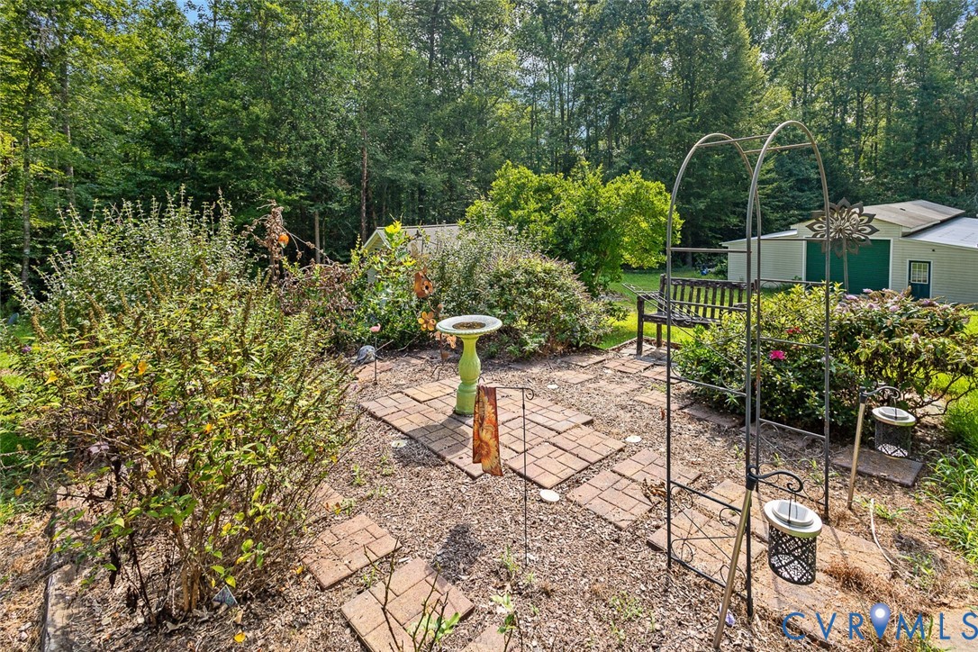 212 Copper Line Road Bumpass, VA 23024 - Photo 31 of 35 a view of a chair and table in the garden