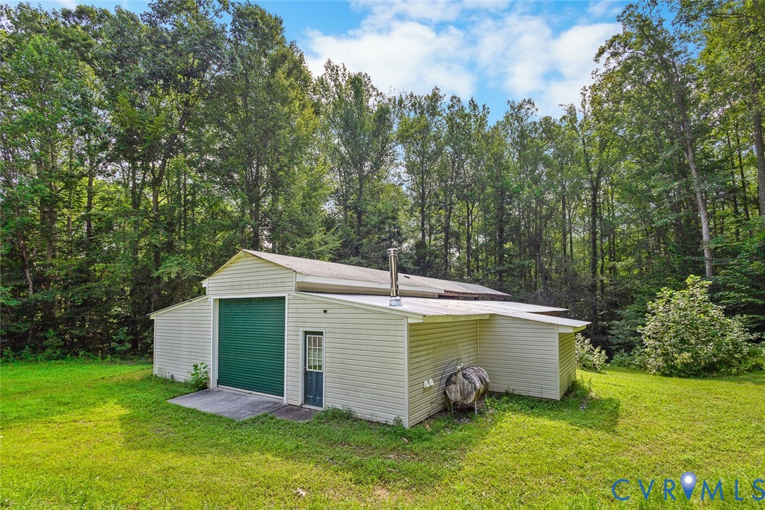 212 Copper Line Road Bumpass, VA 23024 - Photo 32 of 35 a view of a house with a yard