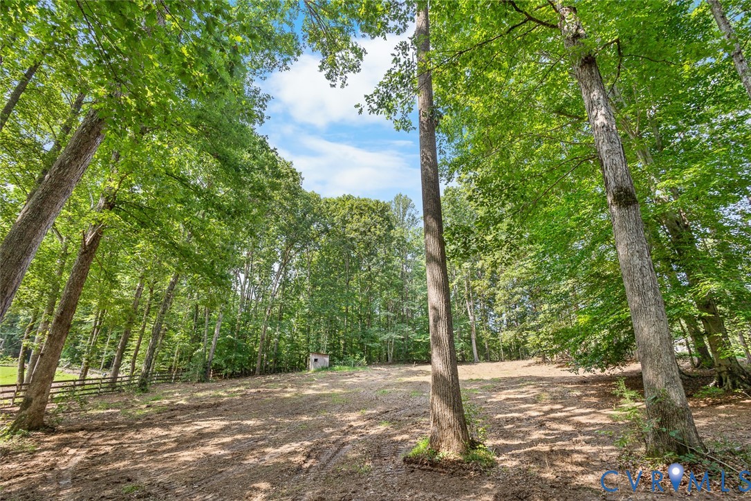 212 Copper Line Road Bumpass, VA 23024 - Photo 34 of 35 a wooden bench with trees in the background