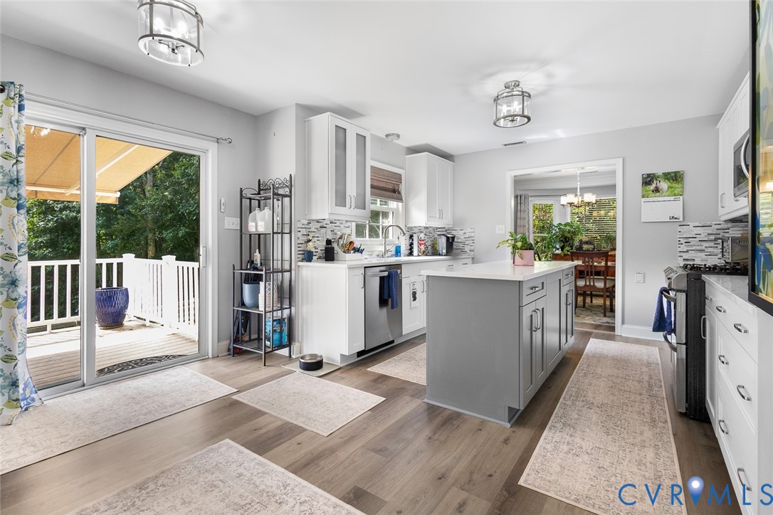 212 Copper Line Road Bumpass, VA 23024 - Photo 9 of 35 a large white kitchen with a large window
