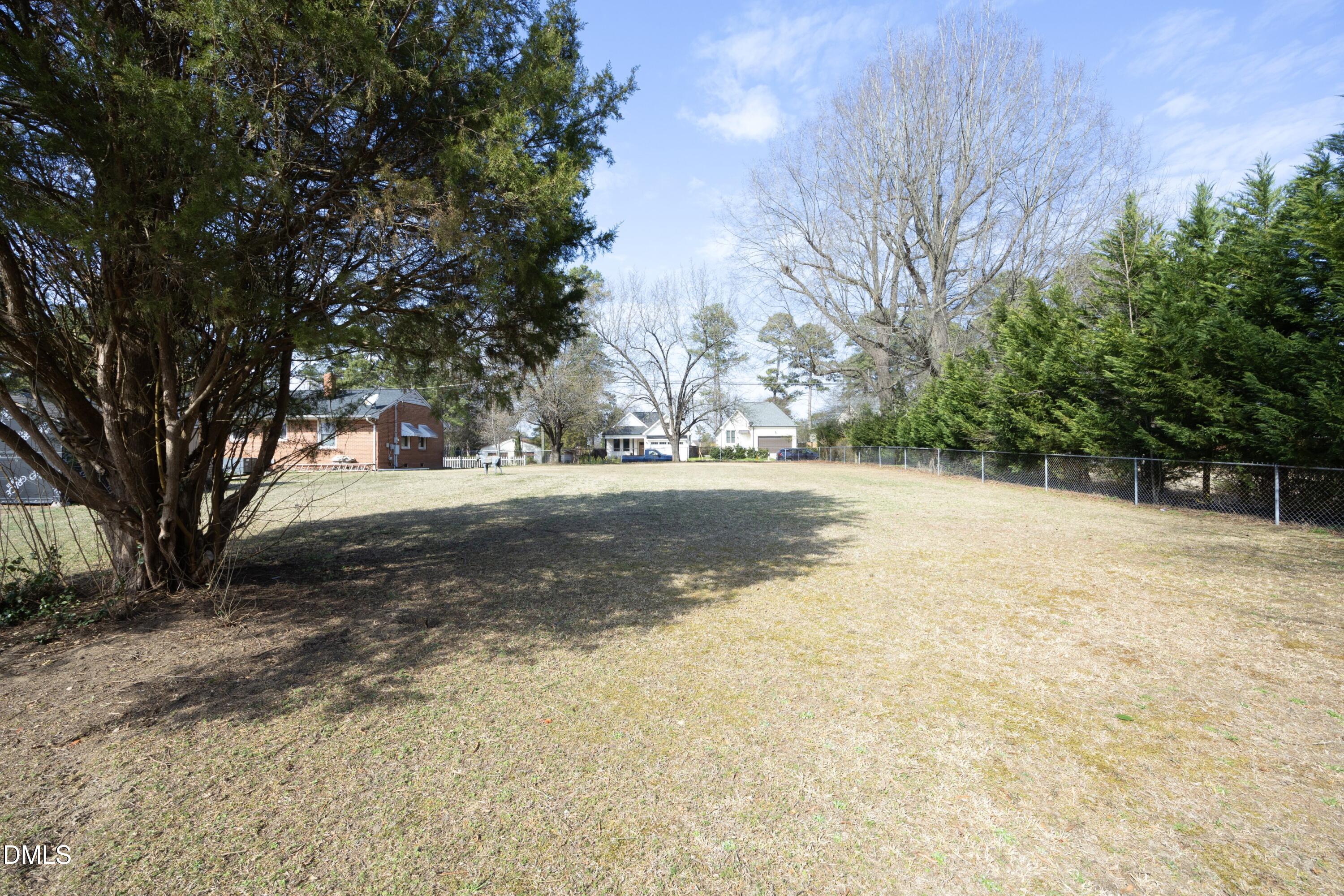3504 Skycrest Drive Raleigh, NC 27604 - Photo 4 of 10 a view of dirt yard with a large tree