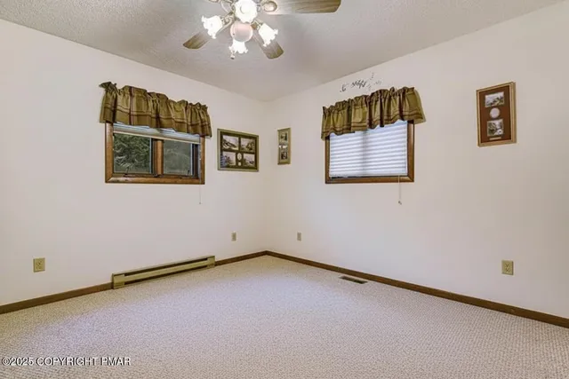 a living room with furniture flat screen tv and a fireplace